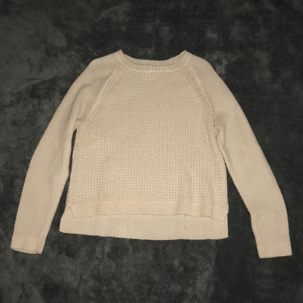 Knitted sweater.